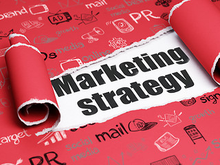 Image showing Marketing concept: black text Marketing Strategy under the piece of  torn paper