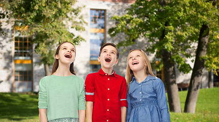 Image showing amazed children looking up over summer campus