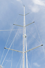 Image showing close up of sailboat mast over blue sky