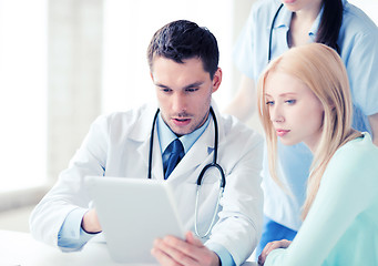 Image showing doctor and nurse with patient in hospital