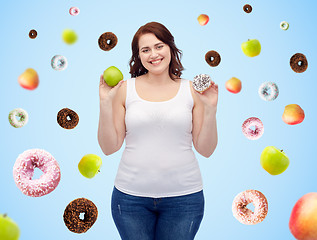 Image showing happy plus size woman choosing apple or donut