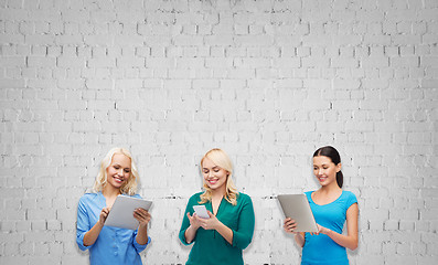 Image showing happy women with smartphone and tablet pc computer