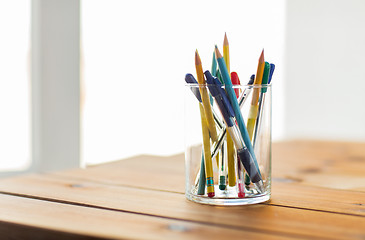 Image showing close up of stand or glass with pens and pencils