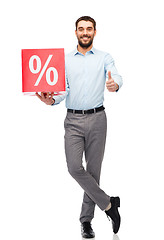 Image showing smiling man with red shopping bag