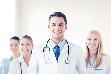 Image showing male doctor in front of medical group