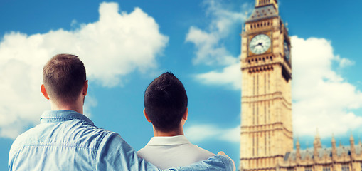 Image showing close up of male gay couple hugging over big ben