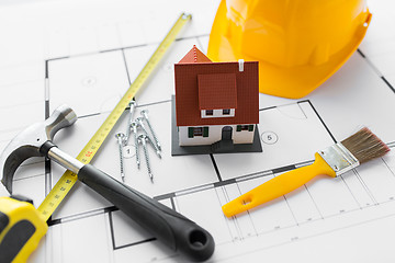 Image showing close up of house blueprint with building tools