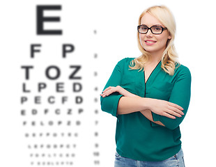 Image showing smiling young woman with eyeglasses