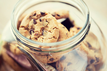 Image showing close up of chocolate oatmeal cookies in glass jar