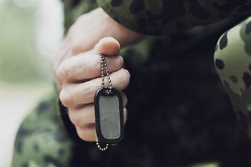 Image showing close up of young soldier in military uniform