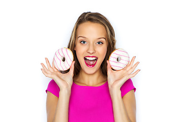 Image showing happy woman or teen girl with donuts