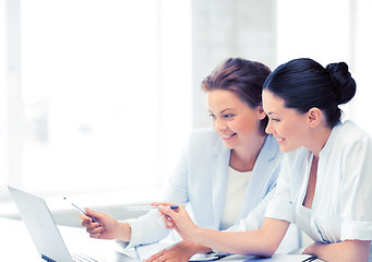 Image showing businesswomen working with laptop in office