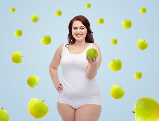 Image showing happy plus size woman in underwear with apple