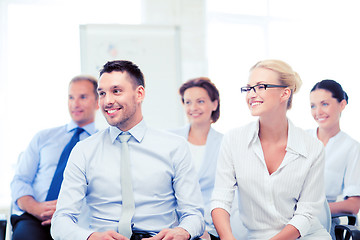 Image showing businessmen and businesswomen on conference