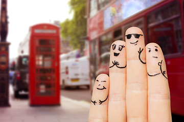 Image showing close up of four fingers with smiley faces