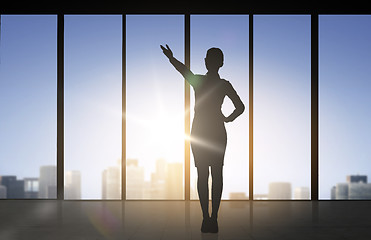 Image showing silhouette of business woman pointing hand