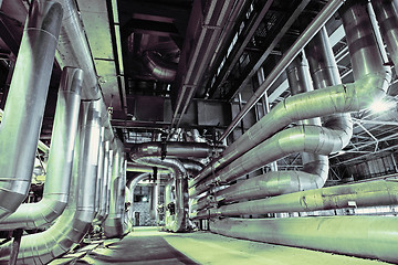 Image showing different size and shaped pipes and valves at a power plant 