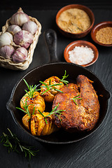 Image showing Pulled pork dish with backed rustic potates