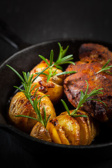 Image showing Pulled pork dish with backed rustic potates