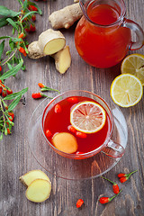 Image showing Tea with fresh goji berries and ginger