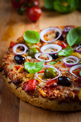 Image showing Traditional homemade pizza with tomatoes and olives