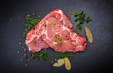 Image showing Fresh raw meat on black board