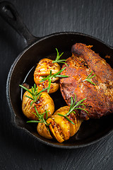 Image showing Pulled pork dish with backed rustic potates