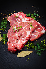 Image showing Fresh raw meat on black board