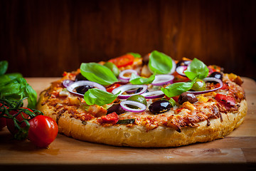 Image showing Traditional homemade pizza with tomatoes and olives