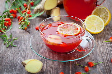 Image showing Tea with fresh goji berries and ginger