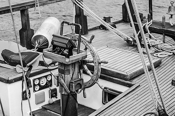 Image showing Steering wheel and deck of the old boat