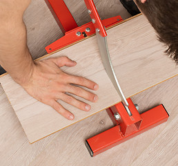 Image showing Red tool for cutting laminate