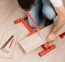 Image showing Red tool for cutting laminate