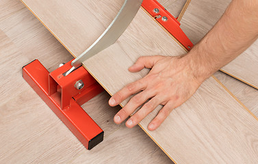 Image showing Red tool for cutting laminate