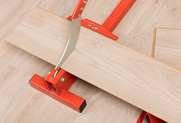 Image showing Red tool for cutting laminate