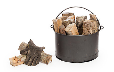 Image showing Metal basket of firewood