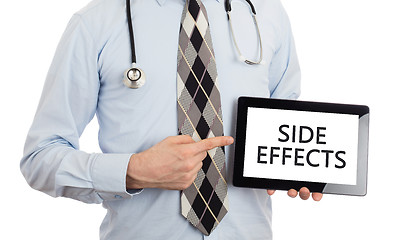 Image showing Doctor holding tablet - Side effects