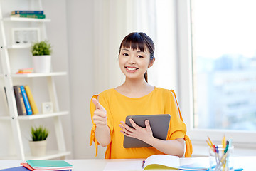 Image showing happy asian woman student with tablet pc at home