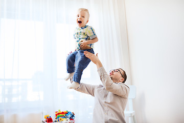 Image showing father with son playing and having fun at home