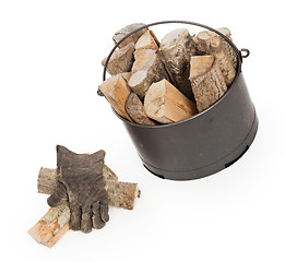 Image showing Metal basket of firewood