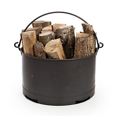 Image showing Metal basket of firewood