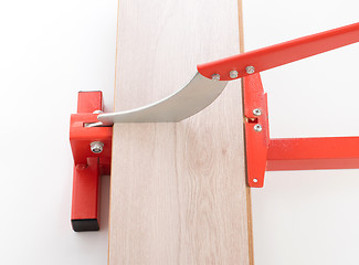 Image showing Red tool for cutting laminate