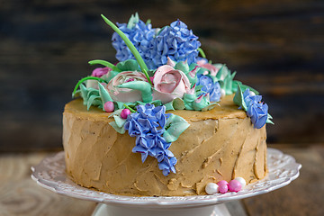 Image showing Coffee cake with flowers.