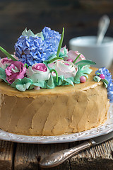 Image showing Cake with cream flowers from close up.