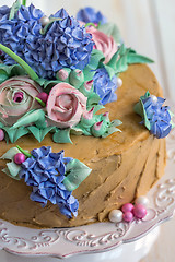Image showing Festive cake with flowers of cream closeup.