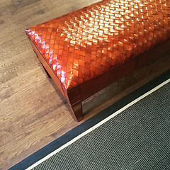 Image showing Fancy leather bench on wooden floor