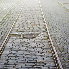 Image showing Tram rails and manhole cover