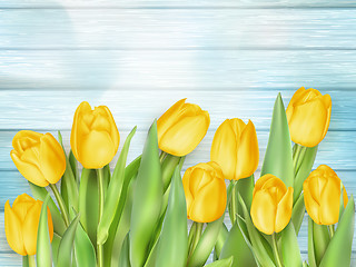 Image showing Yellow tulips flowers on wooden planks. EPS 10