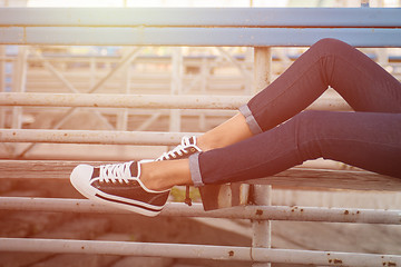 Image showing closeup of woman legs in white gumshoes