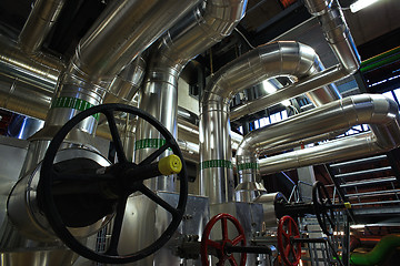 Image showing Equipment, cables and piping as found inside of a modern industr